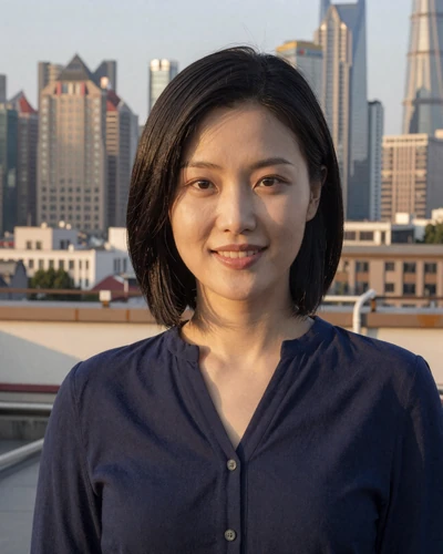 Yue, 28, Chinese woman on Shanghai rooftop with skyline at golden hour