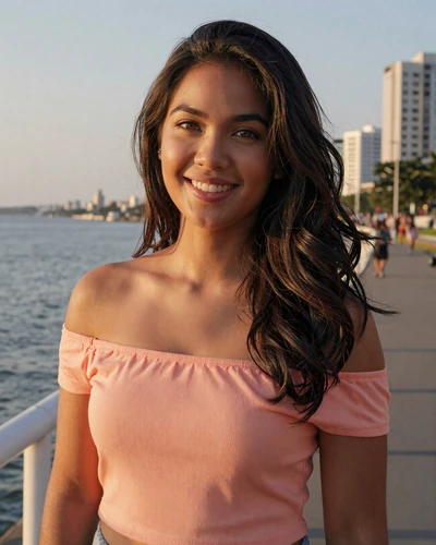 Grace, 26, Filipino woman smiling on Manila Bay boardwalk at sunset