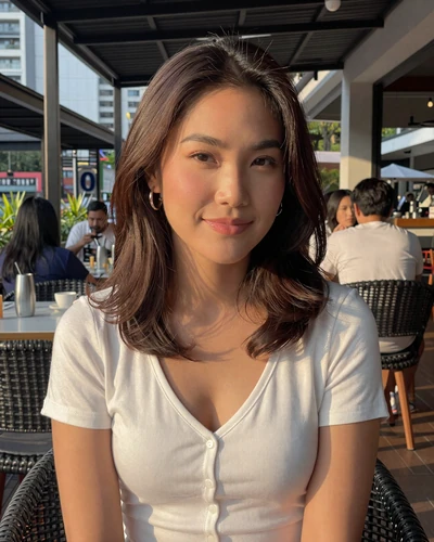 Ploy, 27, Thai woman at modern restaurant terrace in Bangkok Thailand