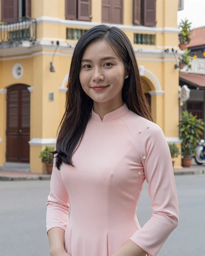 Bao, 27, Vietnamese woman in pastel pink blouse on Hanoi Old Quarter street